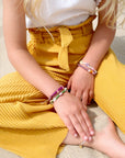 Loveissue - bracelet - daisy - smiley, sunshine,  green & purple (3-6Y)